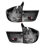 A pair of aftermarket car tail lights with smoked lenses and integrated LED light bars, shown against a plain white background.